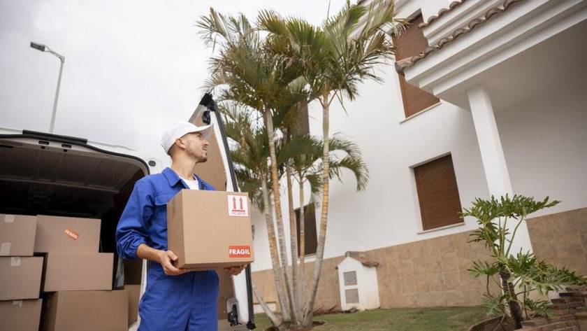 medium-shot-delivery-man-holding-box